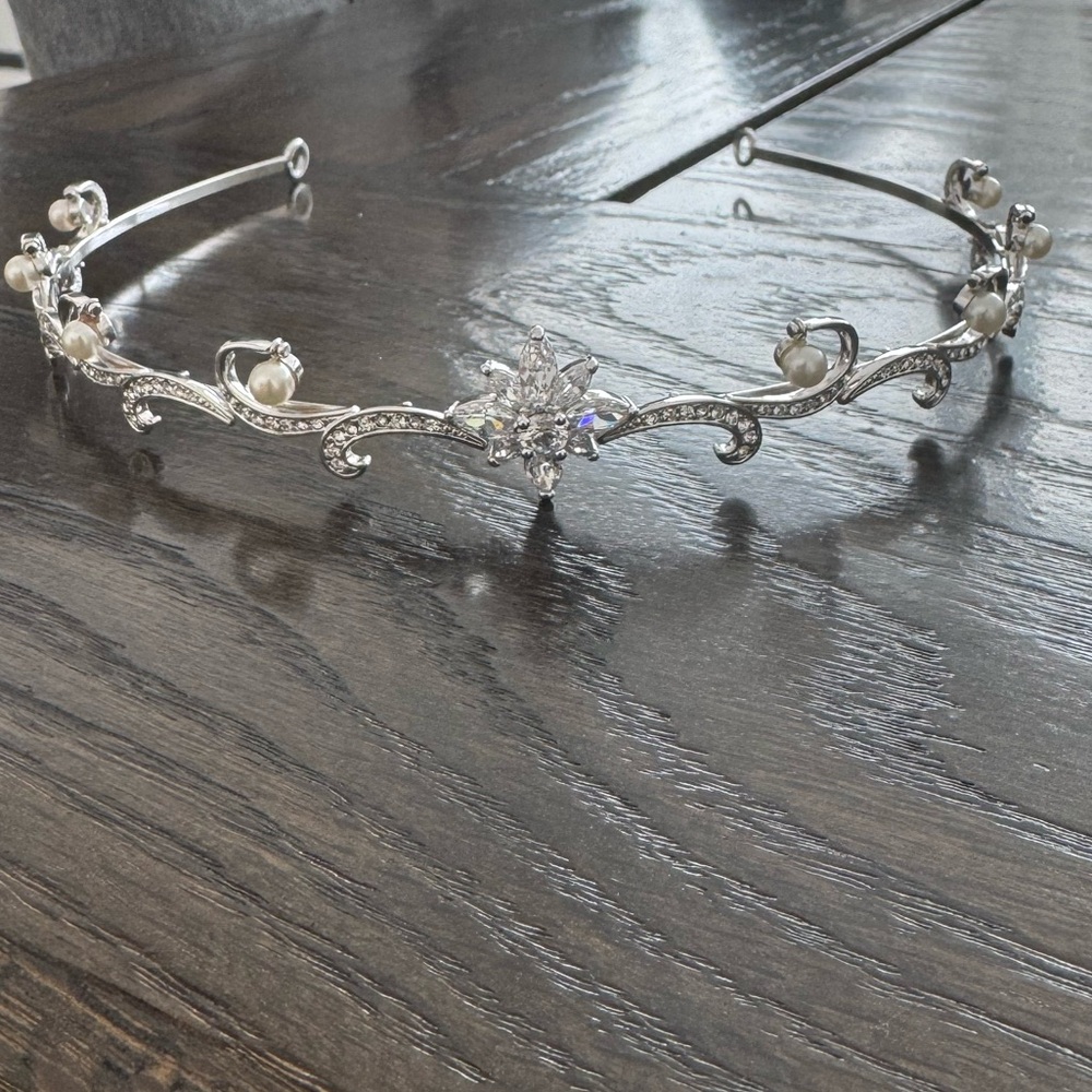 Wedding tiara . Never used , missing two small stones , refer to picture